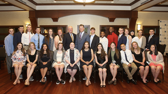 A group of scholarship recipients and ESB employees posing for the camera at an event